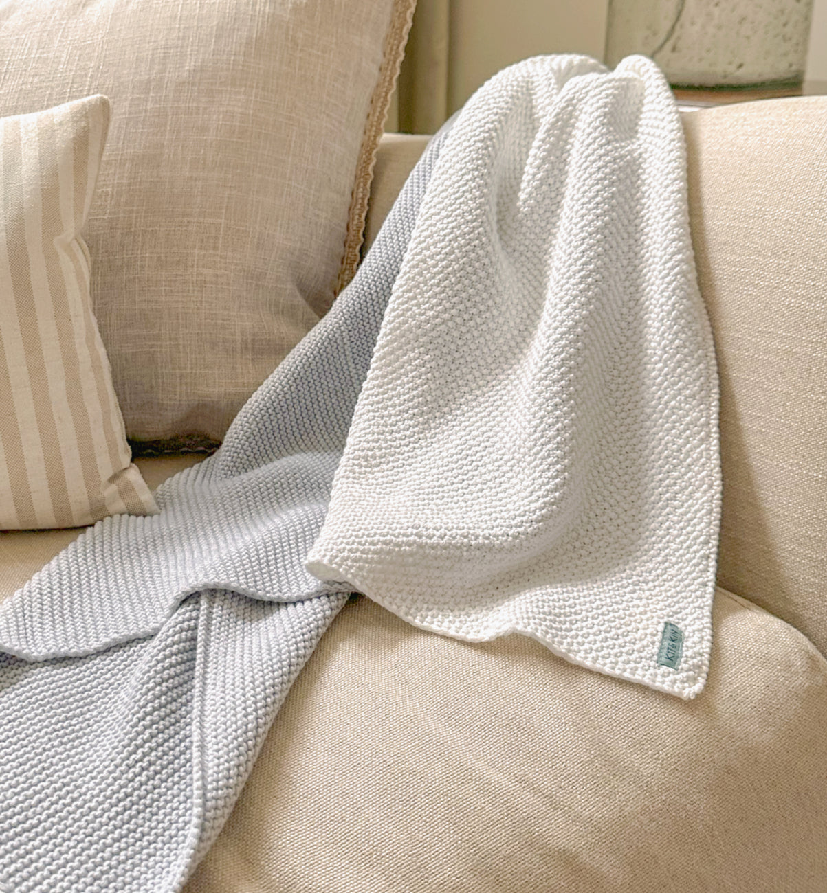 Our cosy Kit & Kin knitted organic cotton baby blanket, the perfect unisex baby gift for newborns.