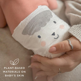 Baby wearing Kit & Kin plant-based newborn nappy