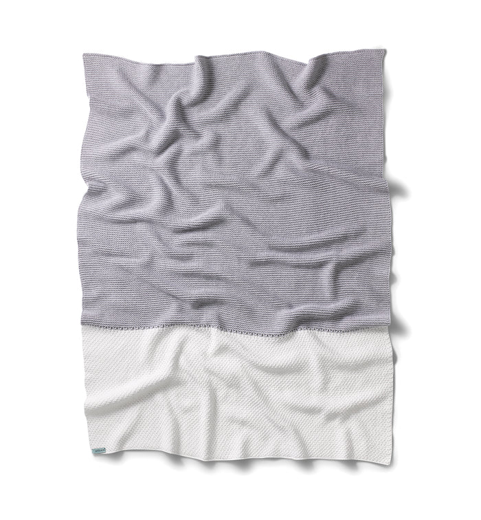 Soft organic cotton knitted baby blanket from Kit & Kin, ideal for unisex newborn gift.