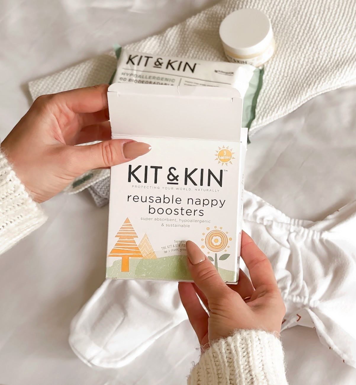 Kit & Kin washable nappy booster from, ideal for cloth nappies and helping prevent leaks. Eco-friendly and gentle on sensitive baby skin.